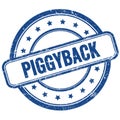 PIGGYBACK text on blue grungy round rubber stamp