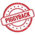 PIGGYBACK text on red grungy round rubber stamp