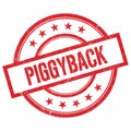 PIGGYBACK text written on red vintage round stamp