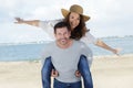 Piggybacks couple at beach Royalty Free Stock Photo