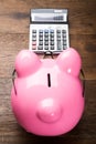 Piggybank With Calculator On Table Royalty Free Stock Photo