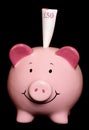 Piggybank with fifty pound note Royalty Free Stock Photo