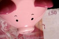 Piggybank with fifty pound note Royalty Free Stock Photo