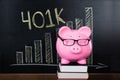 Piggybank In Front Of Blackboard