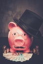 Piggybank in glasses and hat