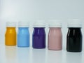 pigment resin paint in the bottle, many colors there are purple, pink, blue, orange, and black