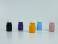 pigment resin paint in the bottle, many colors there are purple, pink, blue, orange, and black