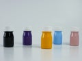 pigment resin paint in the bottle, many colors there are purple, pink, blue, orange, and black