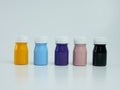 pigment resin paint in the bottle, many colors there are purple, pink, blue, orange, and black