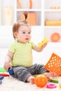 Little baby girl playing with toys