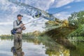 Pike fishing. Photo collage of angler in river water on soft focus muskellunge fish background Royalty Free Stock Photo