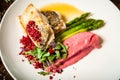 Pike-perch fillet. Asparagus, pearl couscous, white wine sauce, beet-flavored mashed potatoes. Delicious seafood fish