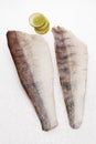 Pike perch with lime slices on white background Royalty Free Stock Photo