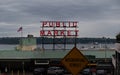 Pike Place Market sign on a stormy day