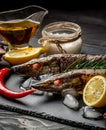 Pike royally. Raw fresh river fish on plate cutting board an old wooden background. Russian cuisine. fish with spices for cooking Royalty Free Stock Photo