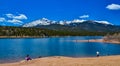 Panorama Snow-capped and forested mountains near a mountain lake, Pikes Peak Mountains in Colorado Spring, Colorado, US