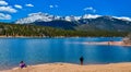 Panorama Snow-capped and forested mountains near a mountain lake, Pikes Peak Mountains in Colorado Spring, Colorado, US