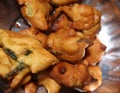 Pikora, pakoda, pakodi, fakkura, bhajiya, bhajji, bhaji or ponako, is a fried snack fritter on the plate. Royalty Free Stock Photo