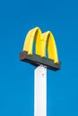 McDonald sign board on blue sky