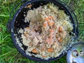 pilaf in a cauldron during the daytime in summer. Royalty Free Stock Photo