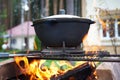 Pilaf cauldron with lattice barbecue. Royalty Free Stock Photo