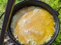 pilaf in a cauldron on an open fire in the daytime in summer. Royalty Free Stock Photo
