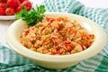 Pilaf with chicken, carrot and green peas