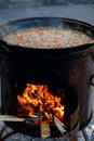 pilaf is cooking in the cauldron