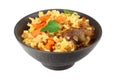 pilaf with meat in black bowl isolated on white background Royalty Free Stock Photo