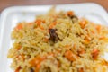 Pilaf of rice with beaf close-up on the plate