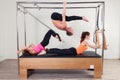 Pilates aerobic instructor a group of three people