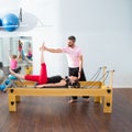 Pilates aerobic personal trainer man in cadillac Royalty Free Stock Photo