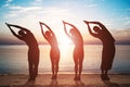 Group Of People Doing Stretching Exercise On Beach Royalty Free Stock Photo