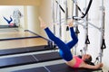 Pilates reformer woman tower exercise