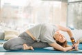 Pilates trainer female showing stretching exercise