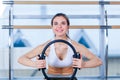 Pilates woman magic ring exercise workout at gym indoor