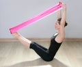 Pilates yoga resistance band red rubber gym woman