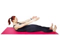 Pilates or yoga. A slender athletic girl performs an exercise on the mat to bend the spine, neck and chest.