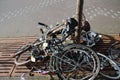 Pile of abandoned bicycles on streets of Den Haag , marked with demolition tape to be removed