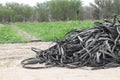 Pile of abandoned tapes for drip irrigation deteriorated, ready to be discarded field agricultural Royalty Free Stock Photo