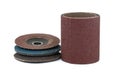 Pile of abrasive discs and sandpaper over white Royalty Free Stock Photo