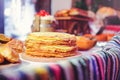 Pile of air pancakes on a wooden dinette, a traditional food family. pancakes of golden color Royalty Free Stock Photo