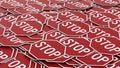 Pile of Aligned Pile of Red Octagonal Stop Signs