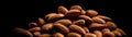 Pile Of Almonds On A Black Background. Generative AI