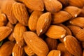 Pile of almonds close-up as background or texture. Royalty Free Stock Photo