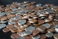 A pile of American cents on an old black wooden surface close-up. Money background Royalty Free Stock Photo