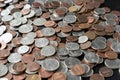 A pile of American cents on an old black wooden surface close-up. Money background Royalty Free Stock Photo