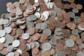 A pile of American cents on an old black wooden surface close-up. Money background Royalty Free Stock Photo