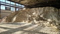 Pile of ammonium sulfate powder inside a warehouse of chemical plant. Mineral fertilizers for agriculture industry