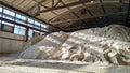 Pile of ammonium sulfate powder inside a warehouse of chemical plant